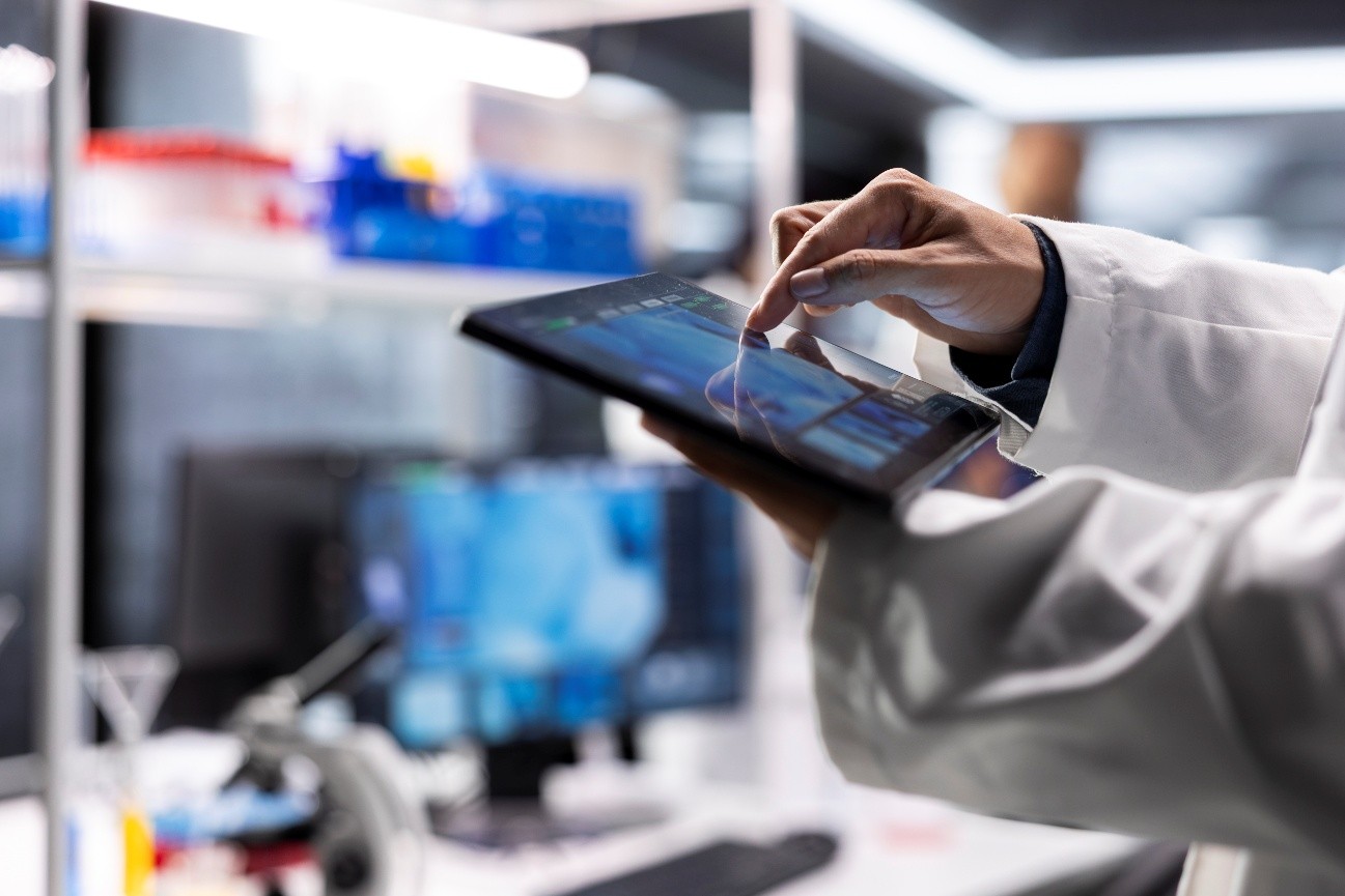 Researcher using a tablet in a modern lab